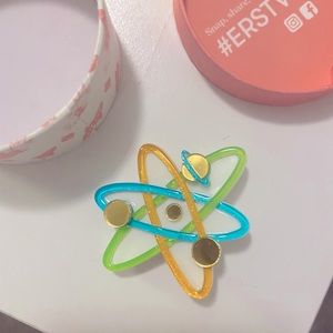 Erstwilder Mini “Up and Atom” brooch.